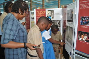 Students of McCook's Primary School at Innswood, St. Catherine, show keen interest in photos which show some of the monuments in the Cathedral.