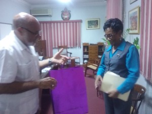 Bishop Gregory presents Mrs. Brown with an anniversary gift.