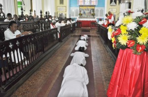 The Ordinands lie prostrate, signifying their submission to God. 