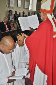 Bishop Gregory lays hands on the Rev. Natalie Blake during her Ordination. 
