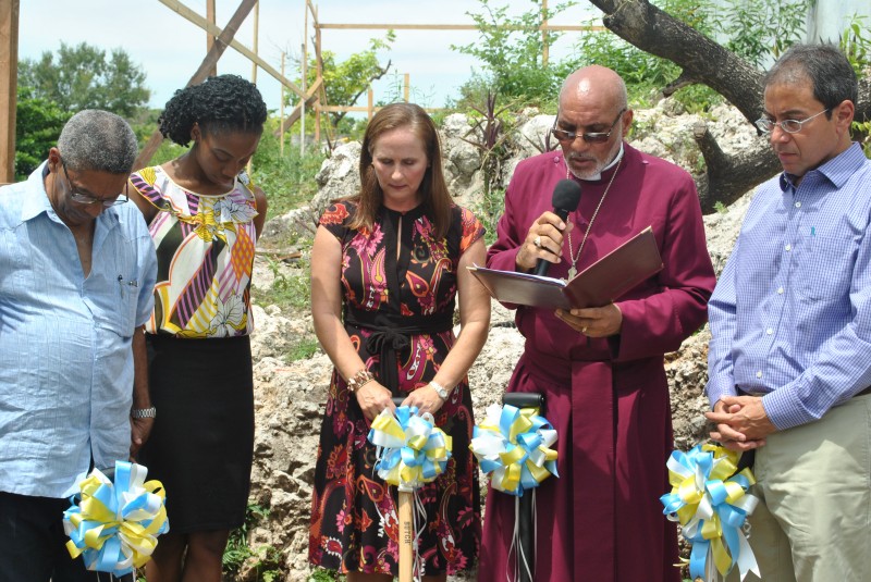 Bishop Howard Gregory (second right) blesses the site. From left are: Mr. Keith Sangster, Chairman of the Home; Miss Delate Howell, a resident; Mrs. Tanya Wildish, Board Member; and Mr. Andrew Mahfood, Chairman, Food for the Poor.